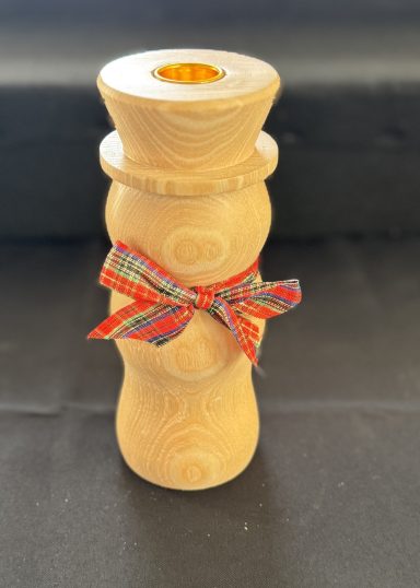 A wooden vase with a decorative ribbon around the centre.